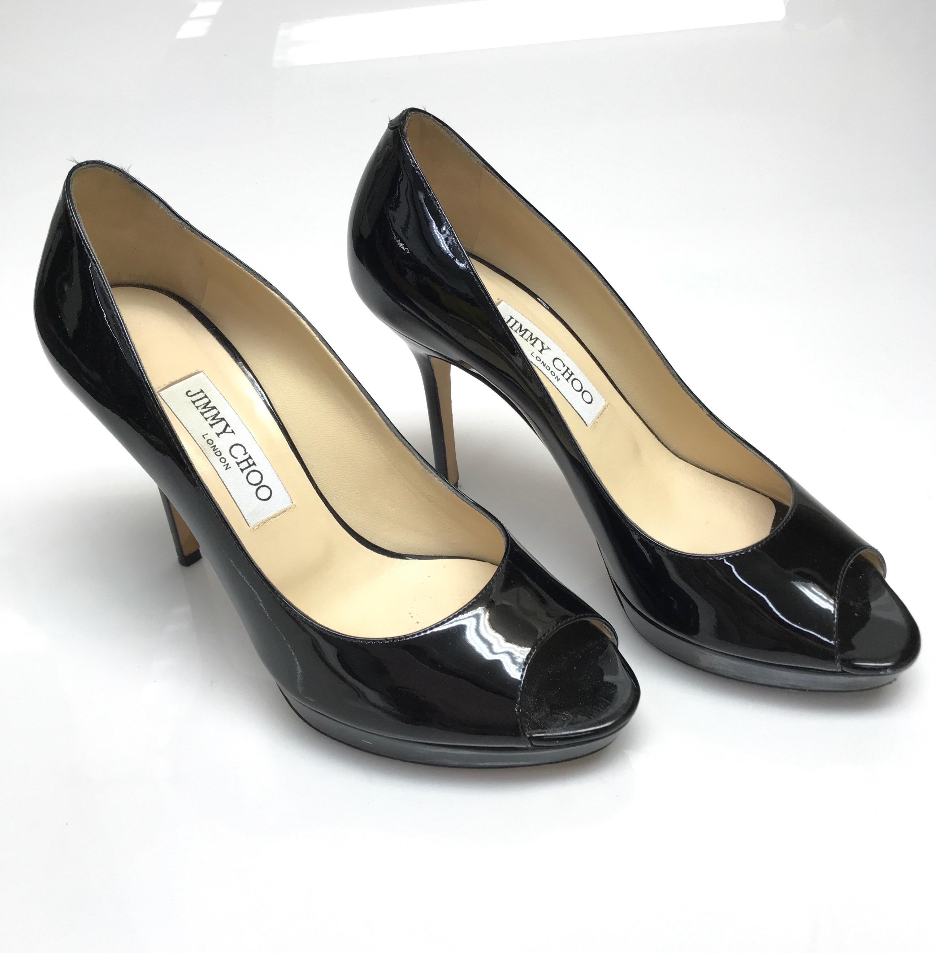 Jimmy Choo Black Patent Leather Peeptoe Heels-38. These stunning jimmy Choo heels are in good condition. They show sign of use on the bottom sole of the shoe as well as minor scuffs/scratches. These shoes are a black patent leather throughout. They