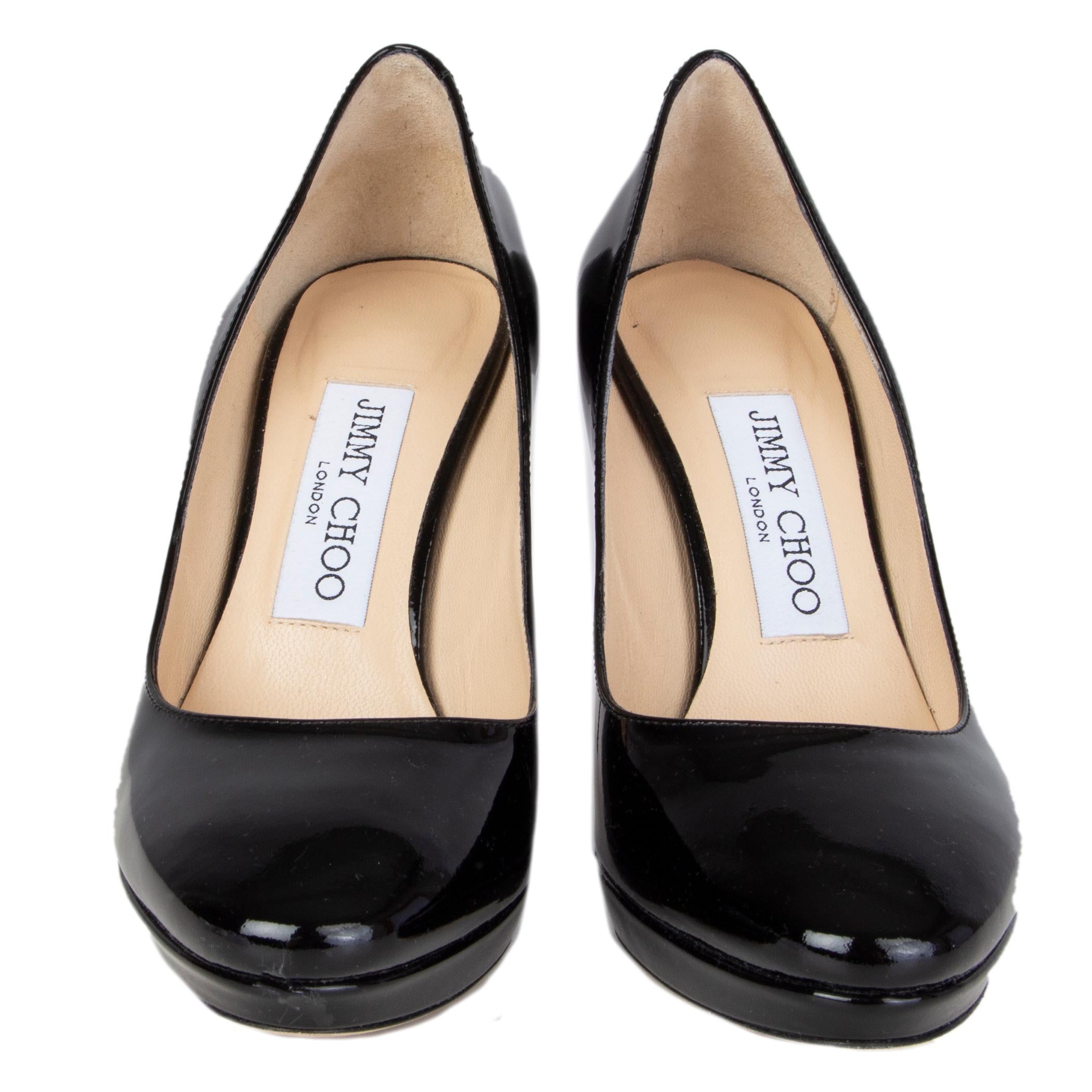 100% authentic Jimmy Choo platform pumps in black patent leather. Have been worn and are in excellent condition. 

Measurements
Imprinted Size	35
Shoe Size	35
Inside Sole	22.5cm (8.8in)
Width	7cm (2.7in)
Heel	9.5cm (3.7in)
Platform:	12cm