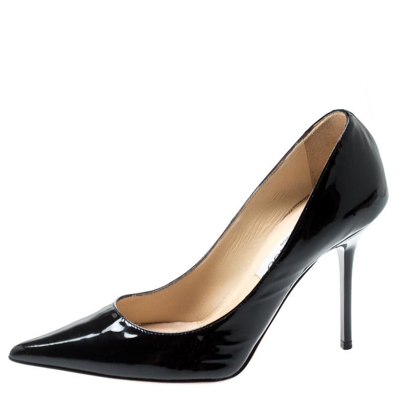 Jimmy Choo brings to you these glossy Romy pumps to complement both your formal and casual wear. These black pumps are crafted from patent leather and feature an elegant silhouette. They flaunt pointed toes, 9.5 cm stiletto heels and leather-lined