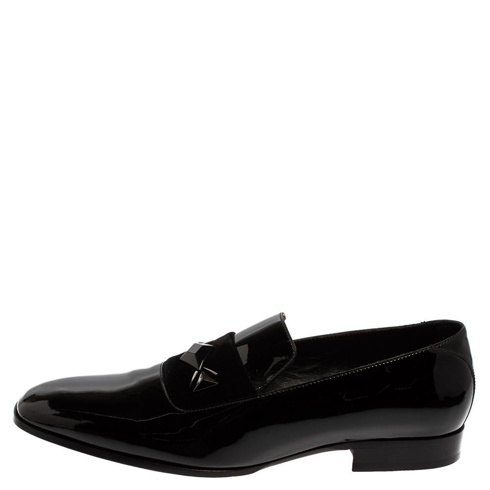 On days you want to make an impression, these loafers from Jimmy Choo will be just perfect! These black loafers are crafted from patent leather and feature rounded square toes and velvet panel details on the vamps. They have been endowed with