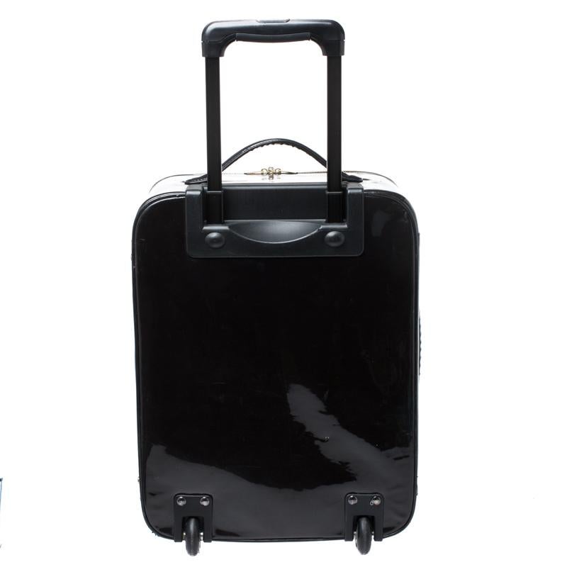 This Jimmy Choo suitcase brings such a fantastic shape that you're sure to look fashionable whenever you carry it. It has been crafted from patent leather in a black hue. The bag is designed with two handles, a front zip pocket, and top zippers to