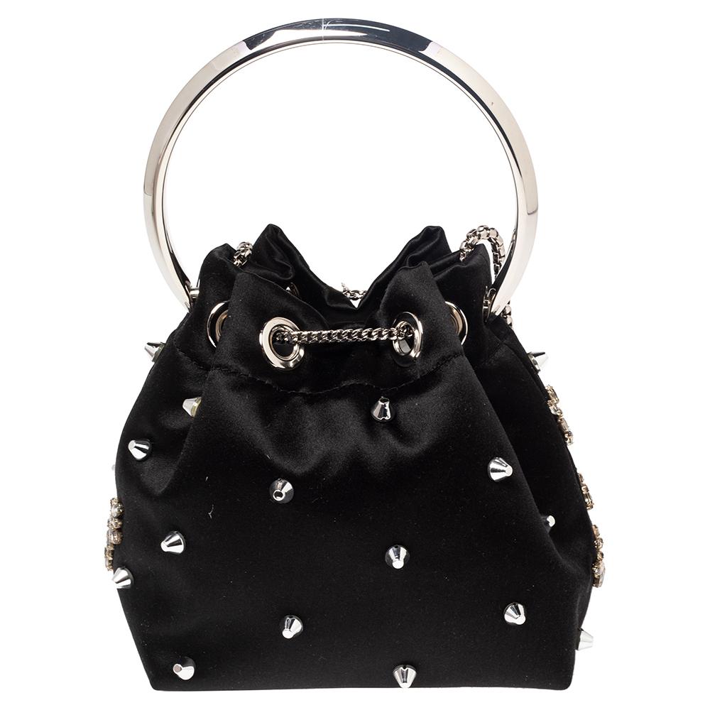This Jimmy Choo Bon Bon bag comes in a bucket silhouette and exemplifies the label's glamorous spirit. Made from satin, the creation is detailed with crystals, a bangle-like handle, and a slender strap. Carry it in your hand or on your shoulder, you