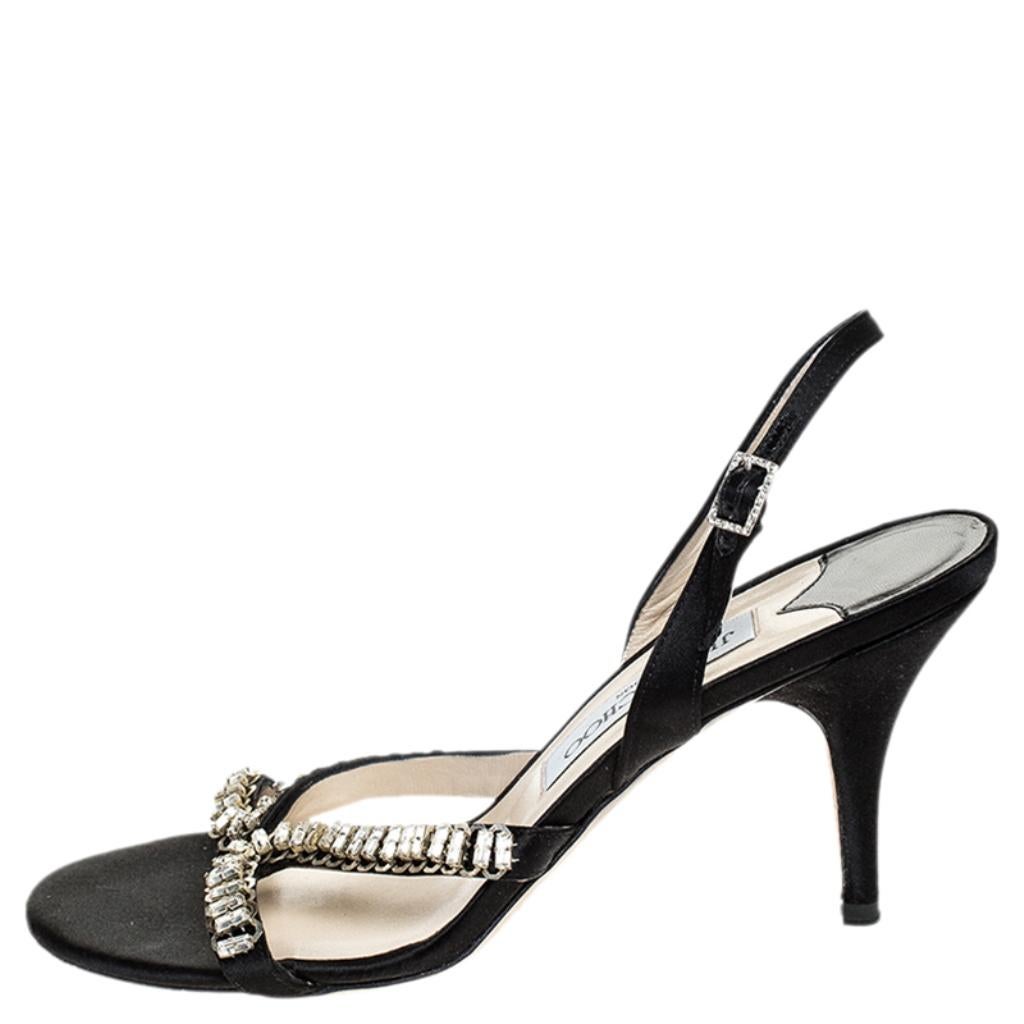 Slip into these Jimmy Choo sandals and add grace to your strides. Crafted from satin, these sandals feature open toes, crystals and buckle slingbacks. Balanced on 8 cm heels, they will give a feel of luxury to your feet.

Includes: The Luxury Closet