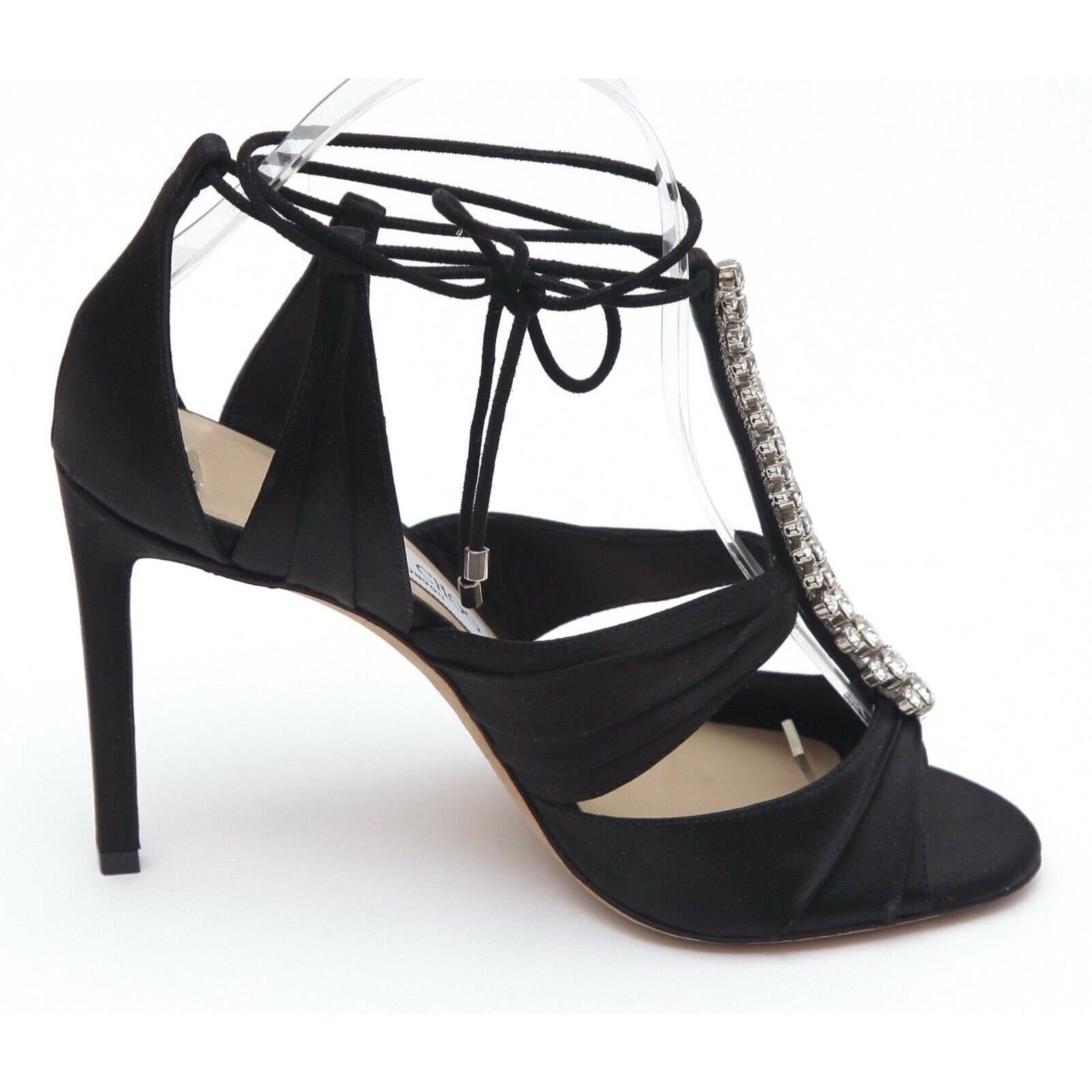 GUARANTEED AUTHENTIC JIMMY CHOO KENNY 100 BLACK SATIN CRYSTAL EMBELLISHED ANKLE TIE SANDALS

Retail excluding sales taxes $1,295

Details:
- Pleated black satin upper.
- Crystal embellished t-strap.
- Satin ankle tie strap closure.
- Leather insole