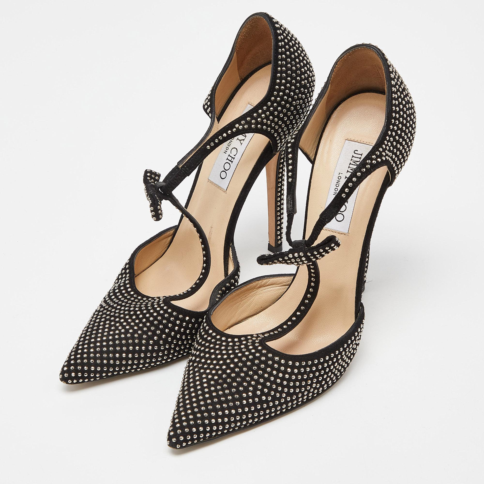 Deliver the most unforgettable looks with these pumps from Jimmy Choo! From their shape to their overall appeal, they are utterly mesmerizing. The pumps come crafted from suede and are detailed with studs, and a T-bar design.

