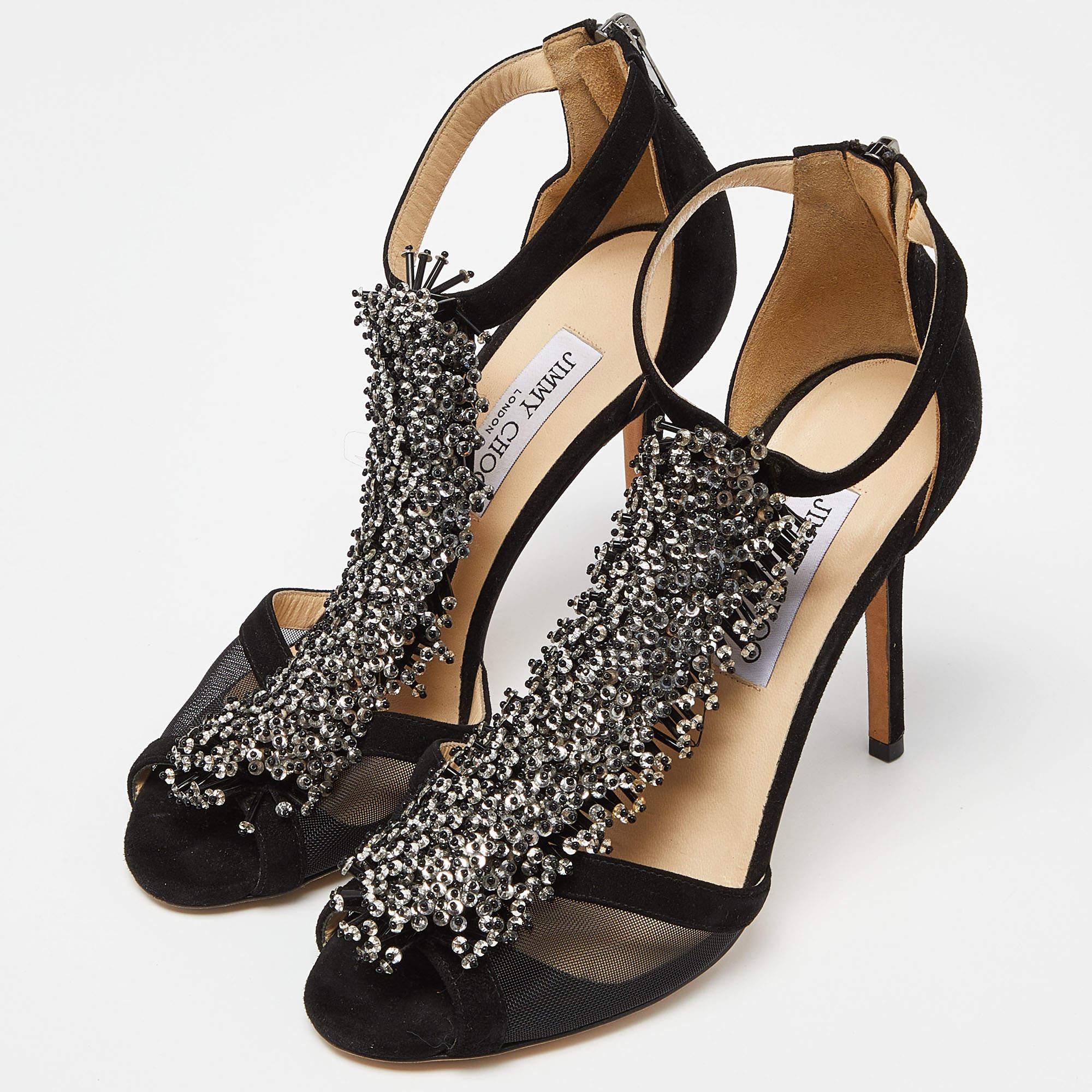 Exhibit an elegant style with this pair of sandals. These Jimmy Choo shoes for women are crafted from quality materials. They are set on durable soles and sleek heels.
