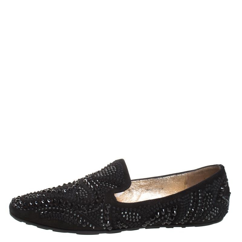 These Jimmy Choo slippers are well-made and oh, so gorgeous! They are covered in crystal embellishments and made from black suede with leather lining on the insoles to provide comfort to your feet. They are easy to slip on and they are surely going