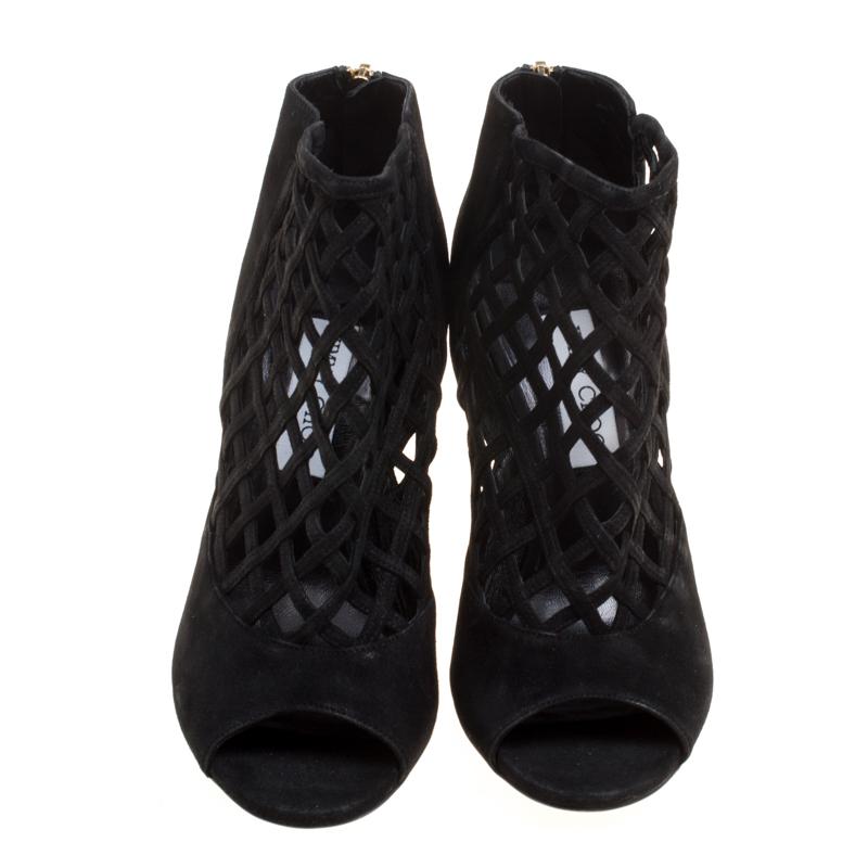 There's too much of gorgeousness in these Jimmy Choo booties! Crafted from suede, these black Drift booties feature a peep-toe silhouette and flaunt a cutout design on the vamps. They come equipped with back zippers, comfortable leather lined
