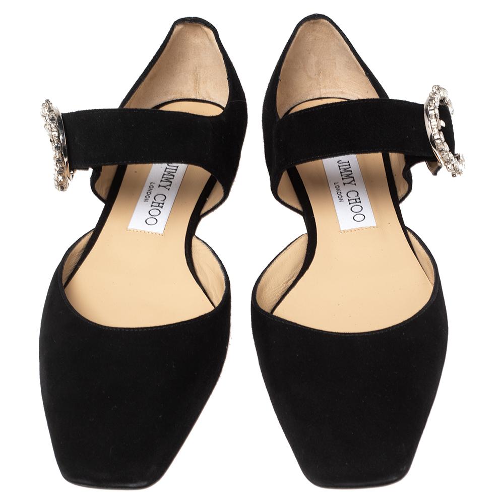 Flaunting a dainty crystal-embellished buckle on the beautiful black suede exterior, these flawless D'Orsay flats provide your feet with a glamourous style. These flats from Jimmy Choo strike a perfect balance between luxury and simplicity.