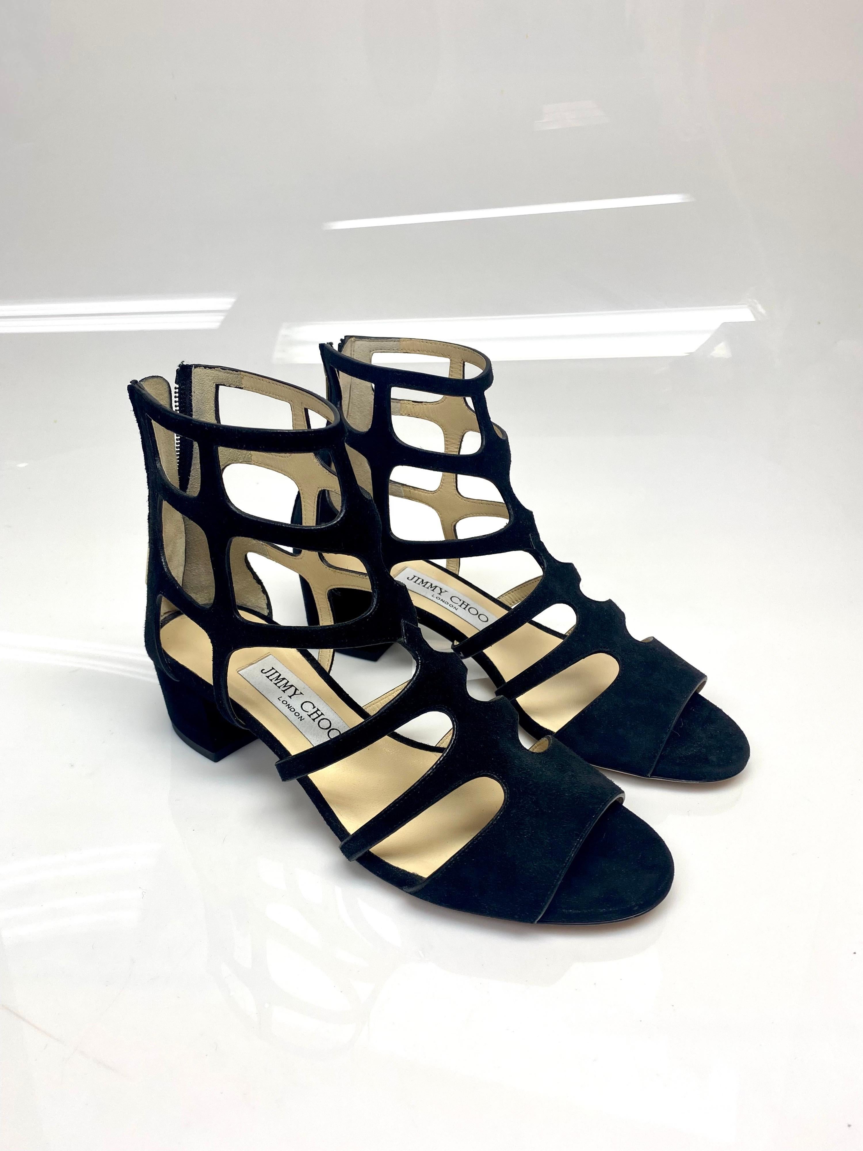 Jimmy Choo Black Gladiator Sandals Shoes Size 36.5. From the House of Jimmy Choo, here comes this simply splendid pair of sandals. Made from black suede in a gladiator style, which grants the pair a very unique look. This pair comes with a peep toe