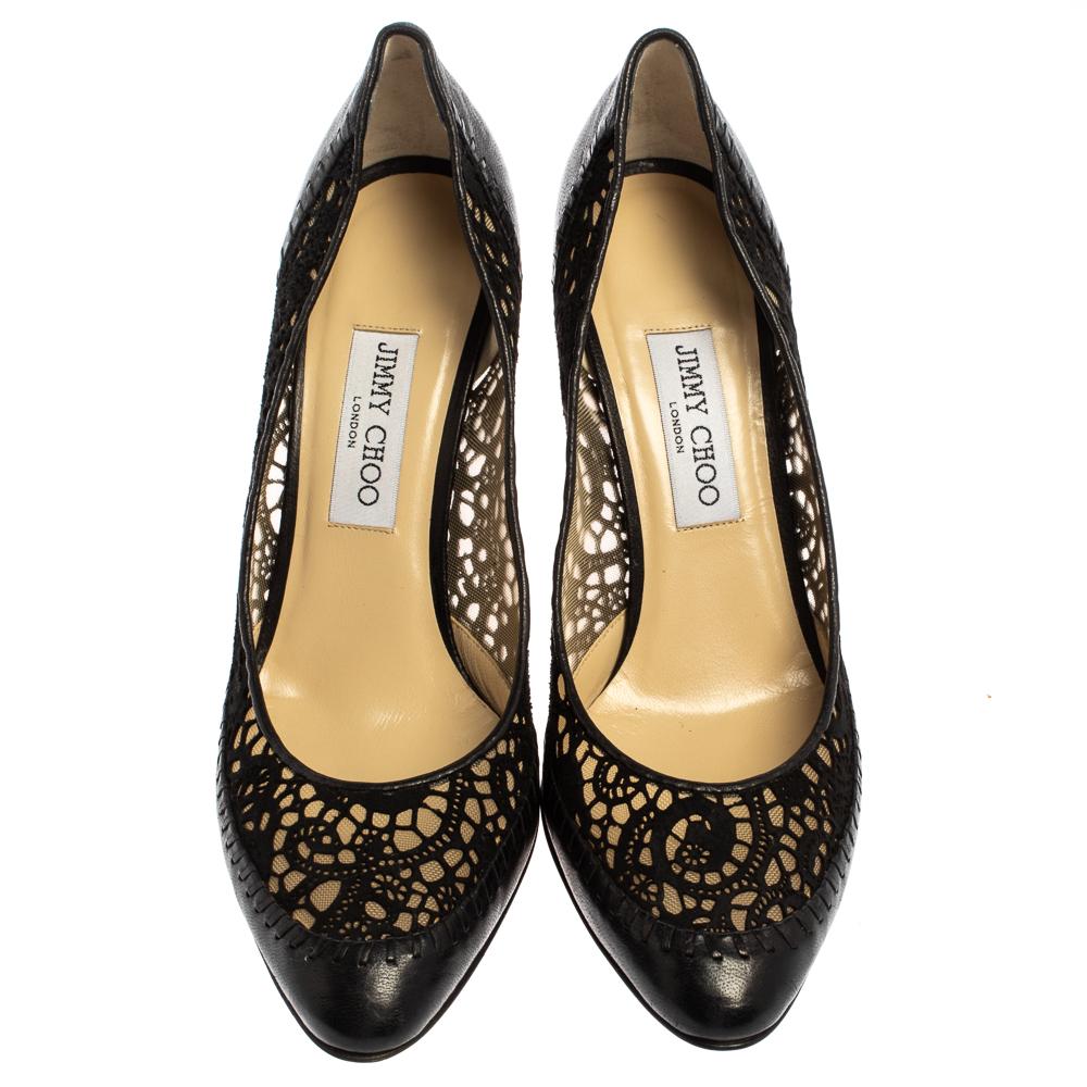 Reach astounding heights in these gorgeous pumps from Jimmy Choo! The black pumps are crafted from suede and leather and feature a laser-cut design on the exterior. They have been styled with almond toes and well-cut vamps and endowed with