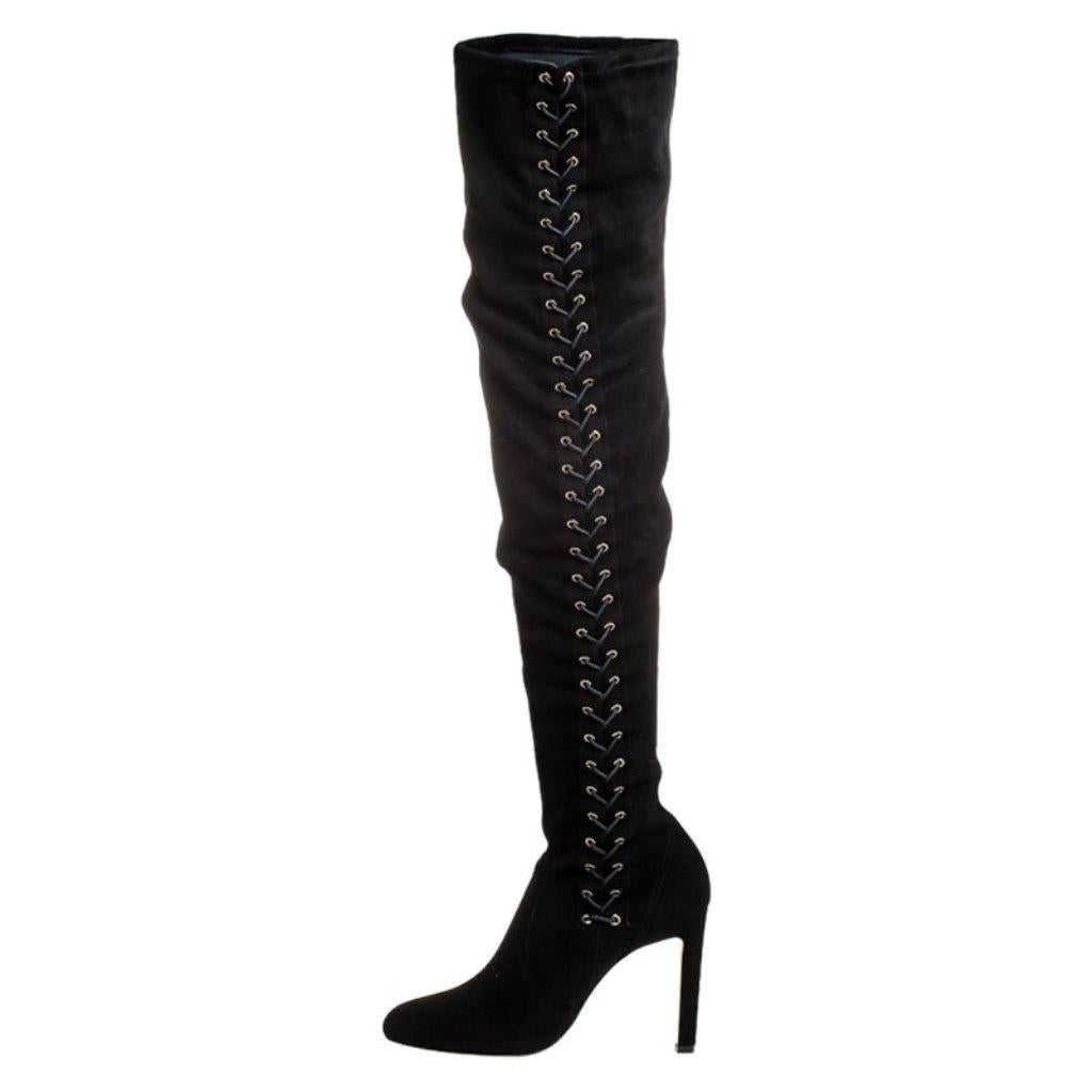 We are praising this pair of boots from Jimmy Choo as they are well-made and utterly gorgeous! They are crafted from suede as over-the-knee and designed with covered toes and 10 cm heels. The boots bring lace details, which make them simply