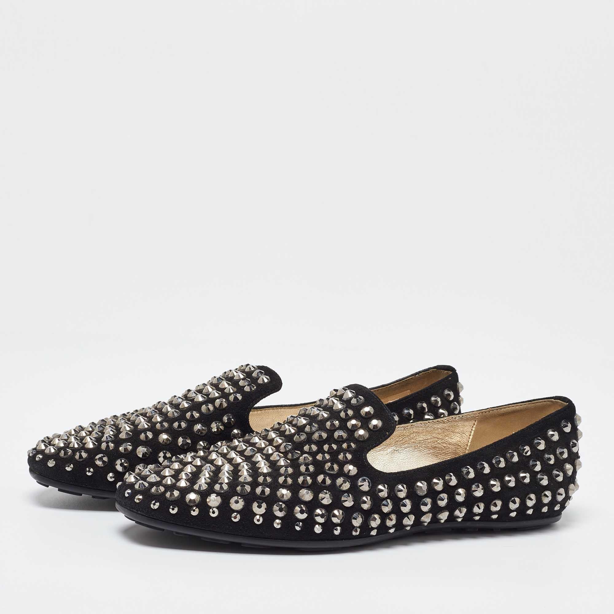 To perfectly complement your attires Jimmy Choo brings you this pair of smoking slippers that speak nothing but beauty. Theyve been fabulously crafted in black suede with intriguing crystal embellishments all over that lend an elegant touch to this