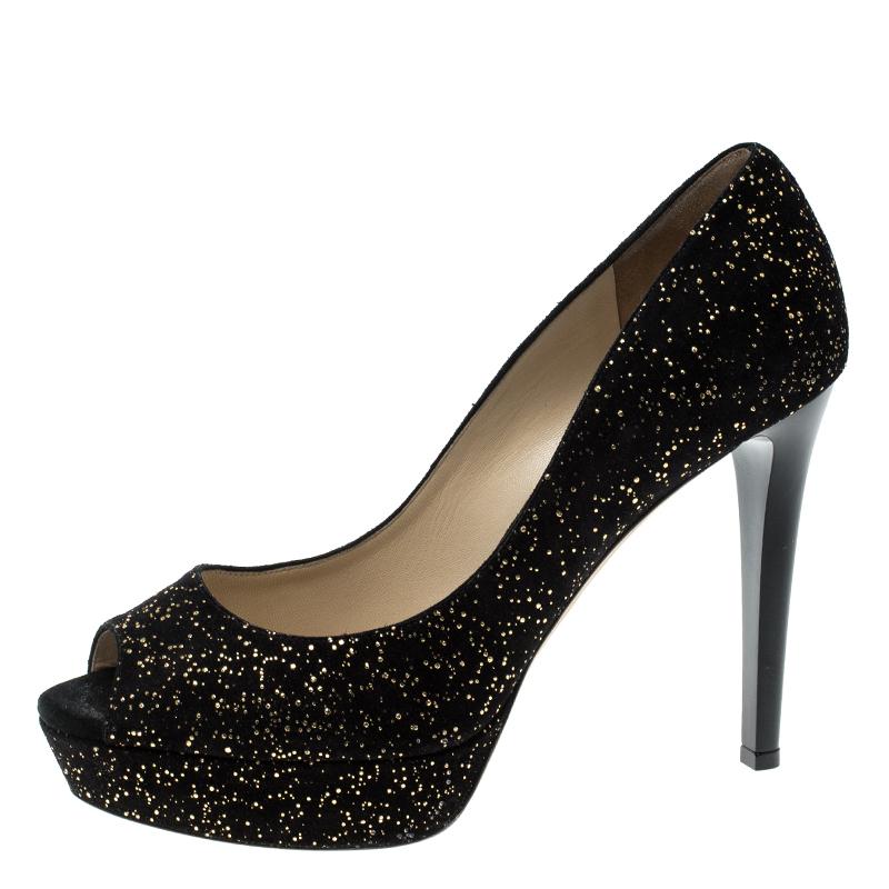 Step out with the highest amount of glamour you could add to your look with these gorgeous pumps from the house of Jimmy Choo. Crafted in a beautiful textured suede, these peep toe pumps stand stylish on platforms and high heels. The gold adds the