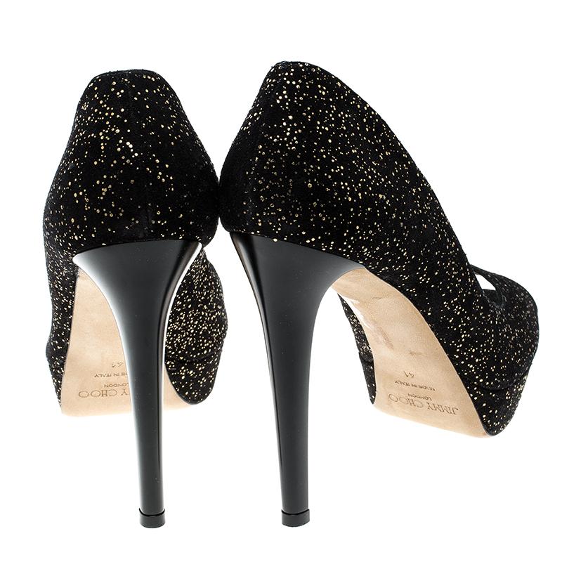 Step out in style and glamour added to your look with these gorgeous pumps from the house of Jimmy Choo. Crafted for comfort in a beautiful textured suede, these peep toe pumps stand apart on platforms and high heels. The gold adds the bling to your