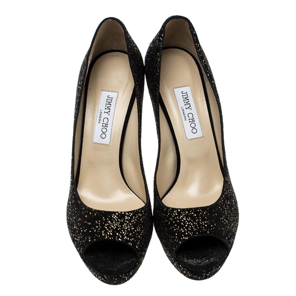 Step out in style and glamour added to your look with these gorgeous pumps from the house of Jimmy Choo. Crafted for comfort in a beautiful textured suede, these peep toe pumps stand apart on platforms and high heels. The gold adds the bling to your