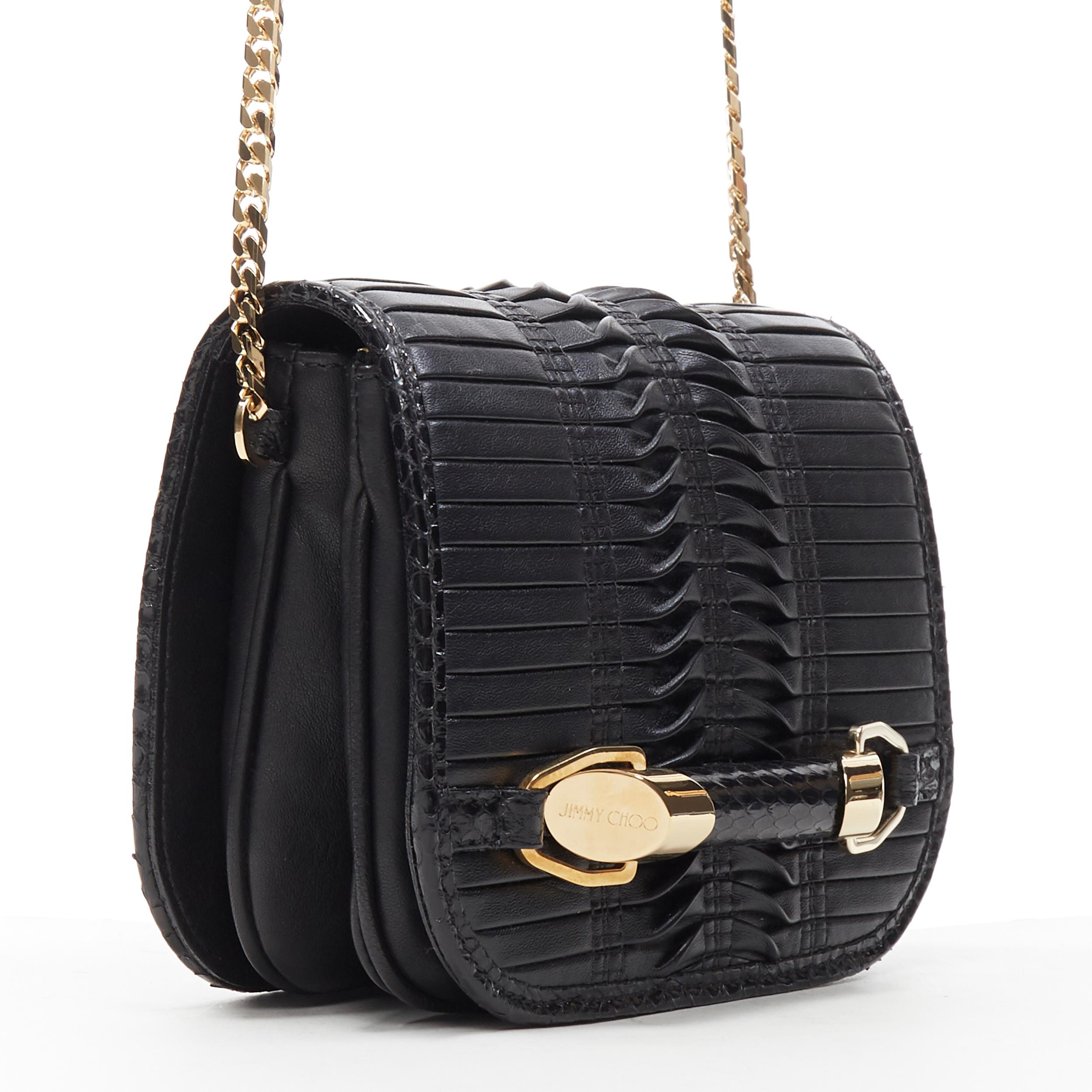 JIMMY CHOO black woven pleated leather gold bar detail flap crossbody bag
Brand: Jimmy Choo
Model Name / Style: Crossbody bag
Material: Leather
Color: Black
Pattern: Solid
Closure: Magnetic
Extra Detail: Genuine leather. Black woven and pleated