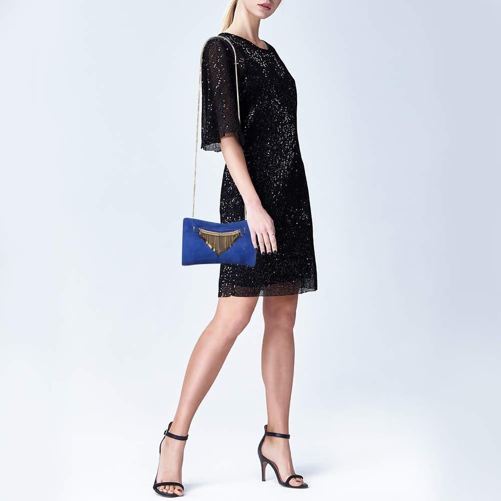 This clutch is just the right accessory to compliment your chic ensemble. It comes crafted in quality material featuring a well sized interior that can comfortably hold all your little essentials.