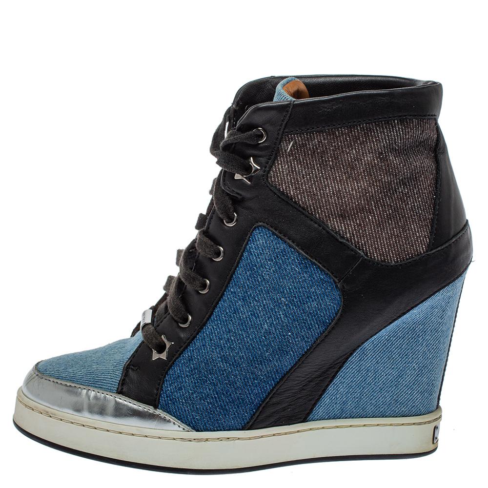Crafted to perfection, these trendy Jimmy Choo Panama wedge sneakers will surely upgrade your shoe collection. Available in a combination of blue and black hues, these sneakers will instantly lend you a stylish makeover. Fashioned in leather &