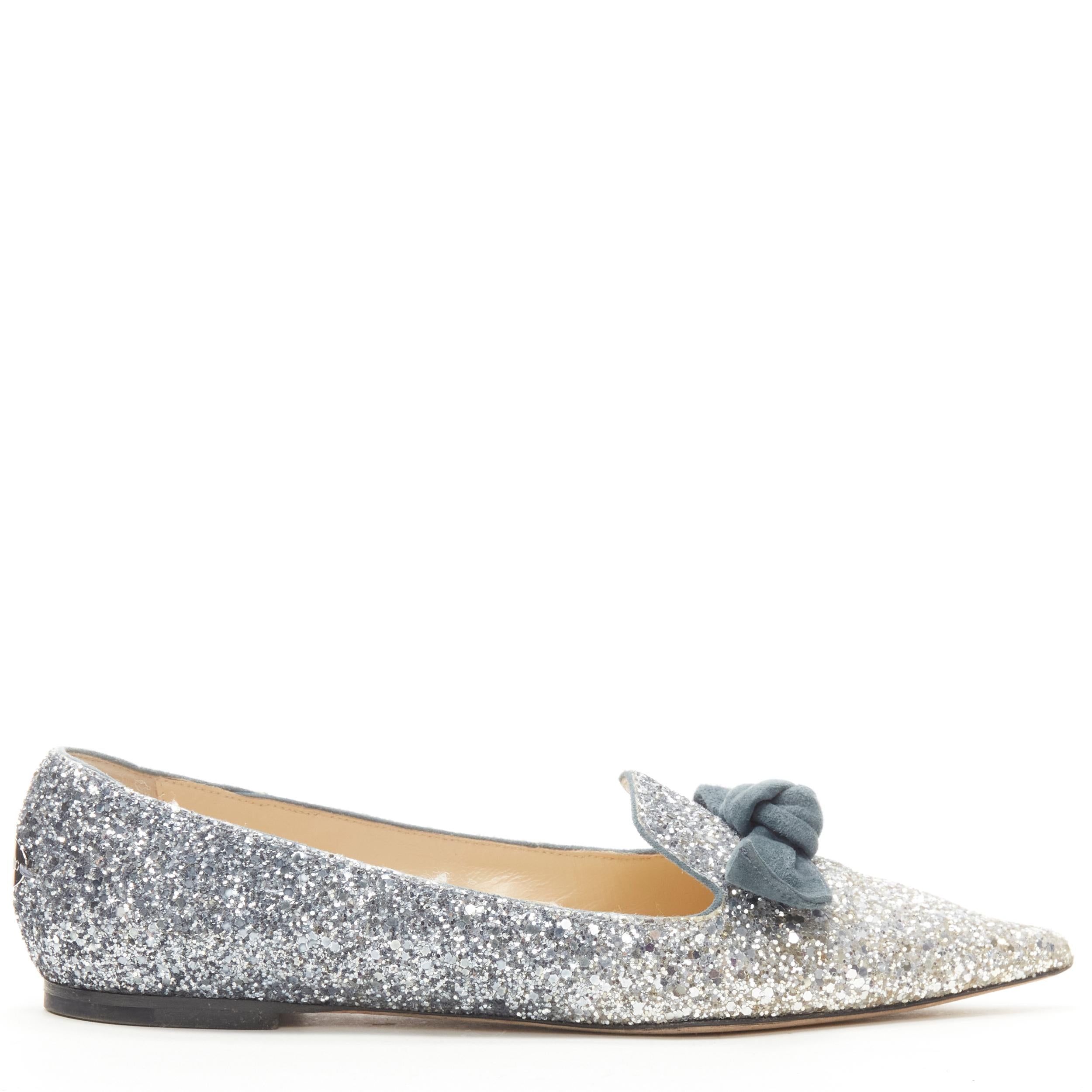 JIMMY CHOO blue silver degrade gradinet course glitter suede bow flats EU38 
Reference: JACG/A00061 
Brand: Jimmy Choo 
Material: Glitter 
Color: Silver 
Pattern: Solid 
Extra Detail: Suede tie bow. Jimmy Choo logo plate at heel.
Made in: Italy