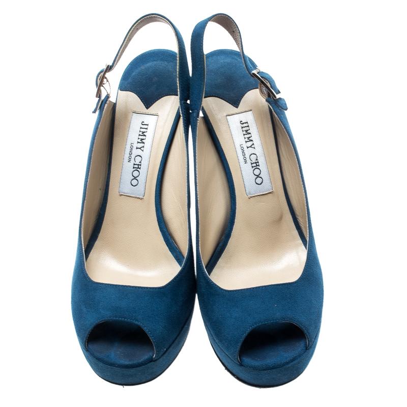 Beautiful in blue, these Lexy sandals from Jimmy Choo will make your heart skip a beat! They are crafted from suede and feature a peep-toe silhouette. They flaunt gold-tone buckle slingbacks, comfortable leather-lined insoles, 12.5 cm block heels