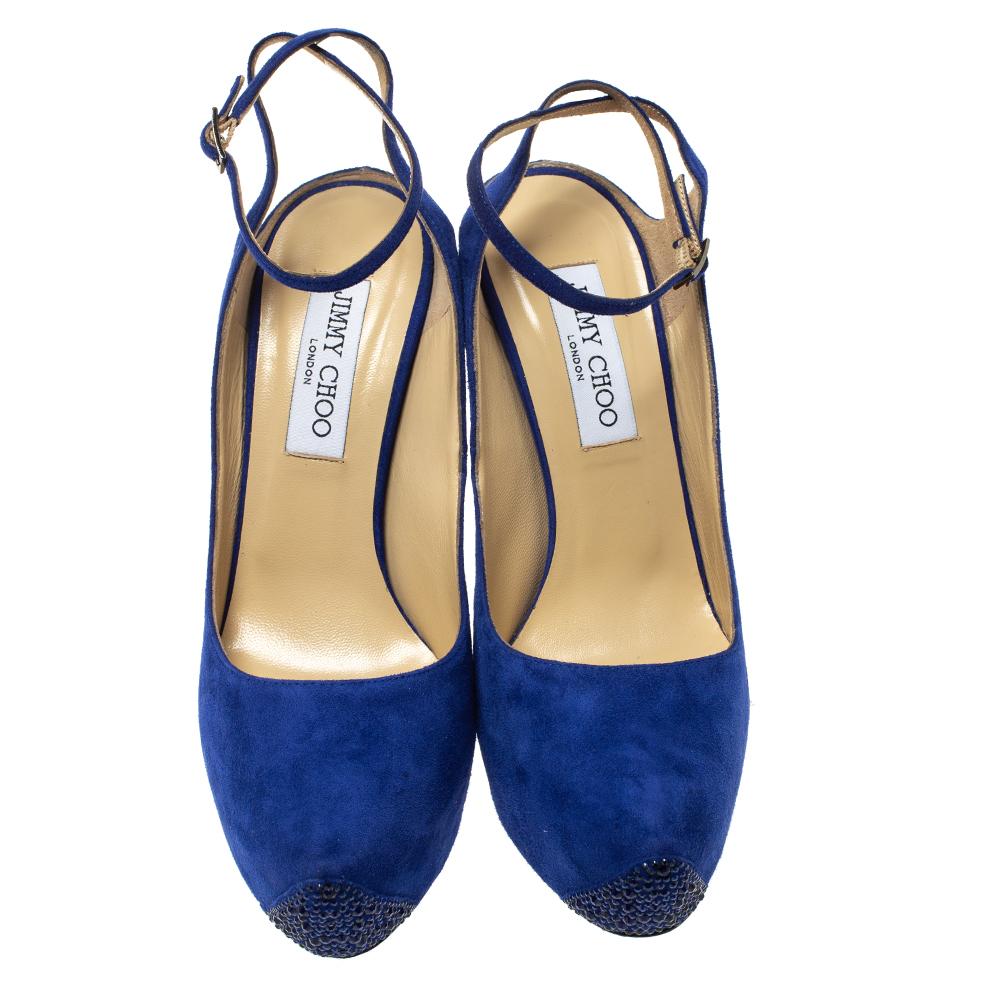 Expect ultra-glamorous styles and old Hollywood charm from a signature Jimmy Choo collection. These pumps are set on embellished platforms, soles and 14 cm heels. Featuring a blue suede exterior, this pair comes with an ankle strap