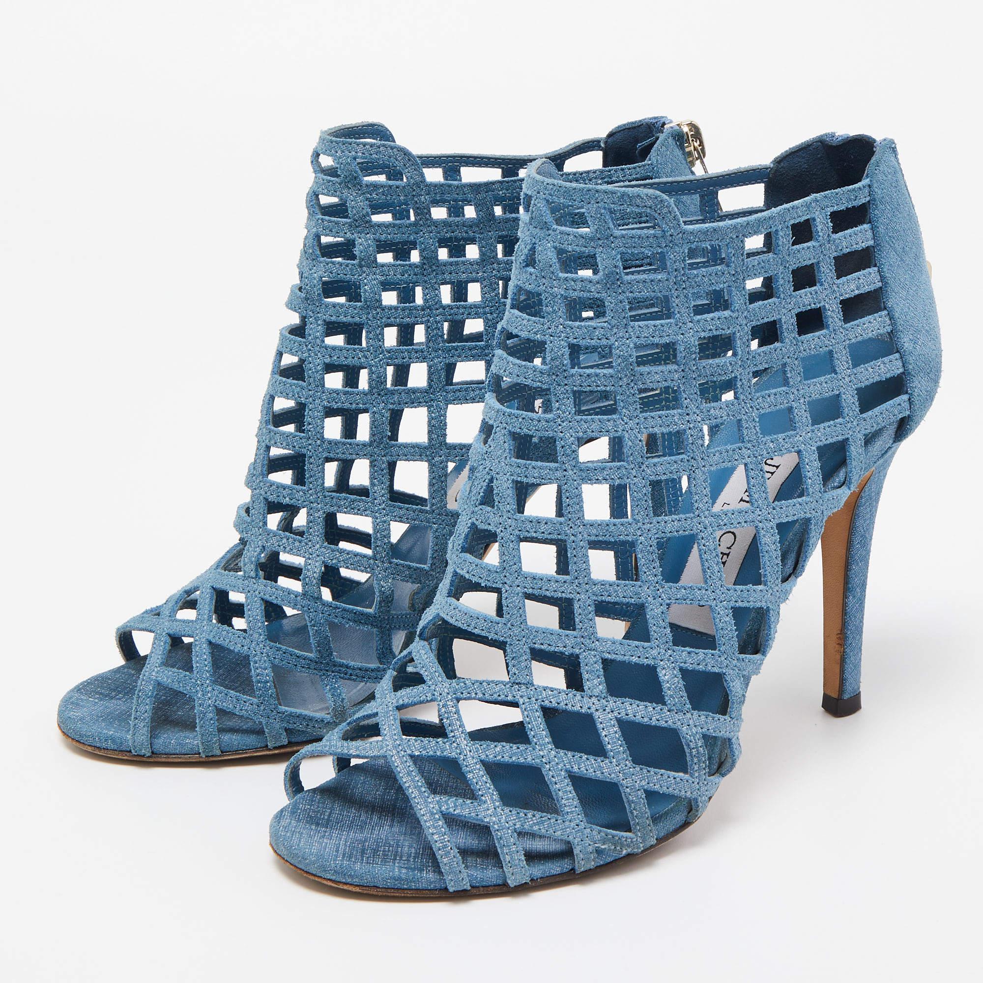 Jimmy Choo's Dassa ankle booties are designed to elegantly frame the feet. Crafted from textured suede, the boots feature a cage-like design all over, peep-toes, and 10cm heels. The refreshing shade of blue makes it a notice-worthy pair.

