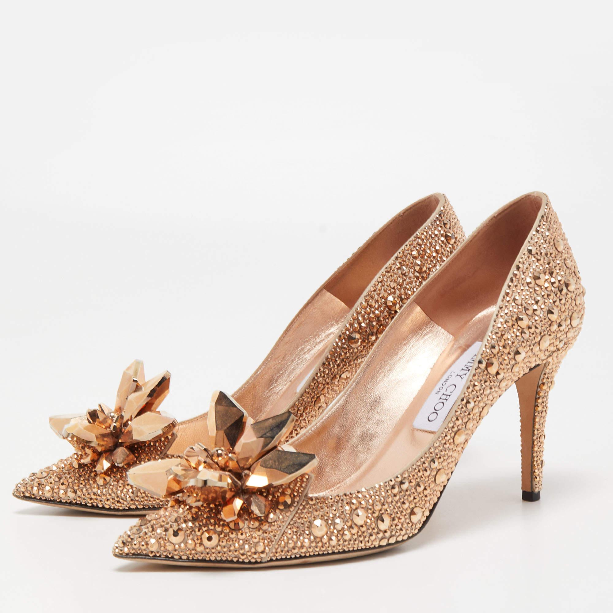 Deliver the most unforgettable looks with these pumps from Jimmy Choo! From their shape and detailing to their overall appeal, they are utterly mesmerizing. The pumps are crafted from crystals and satin. They are complete with comfortable insoles