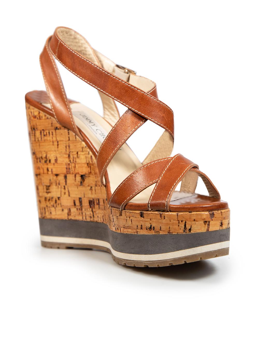 CONDITION is Very good. Minimal wear to the shoes is evident, there is discolouration on the insoles mainly at the front. There is a small separation between the rear of the sandal and the wedge on this used Jimmy Choo designer resale item. These