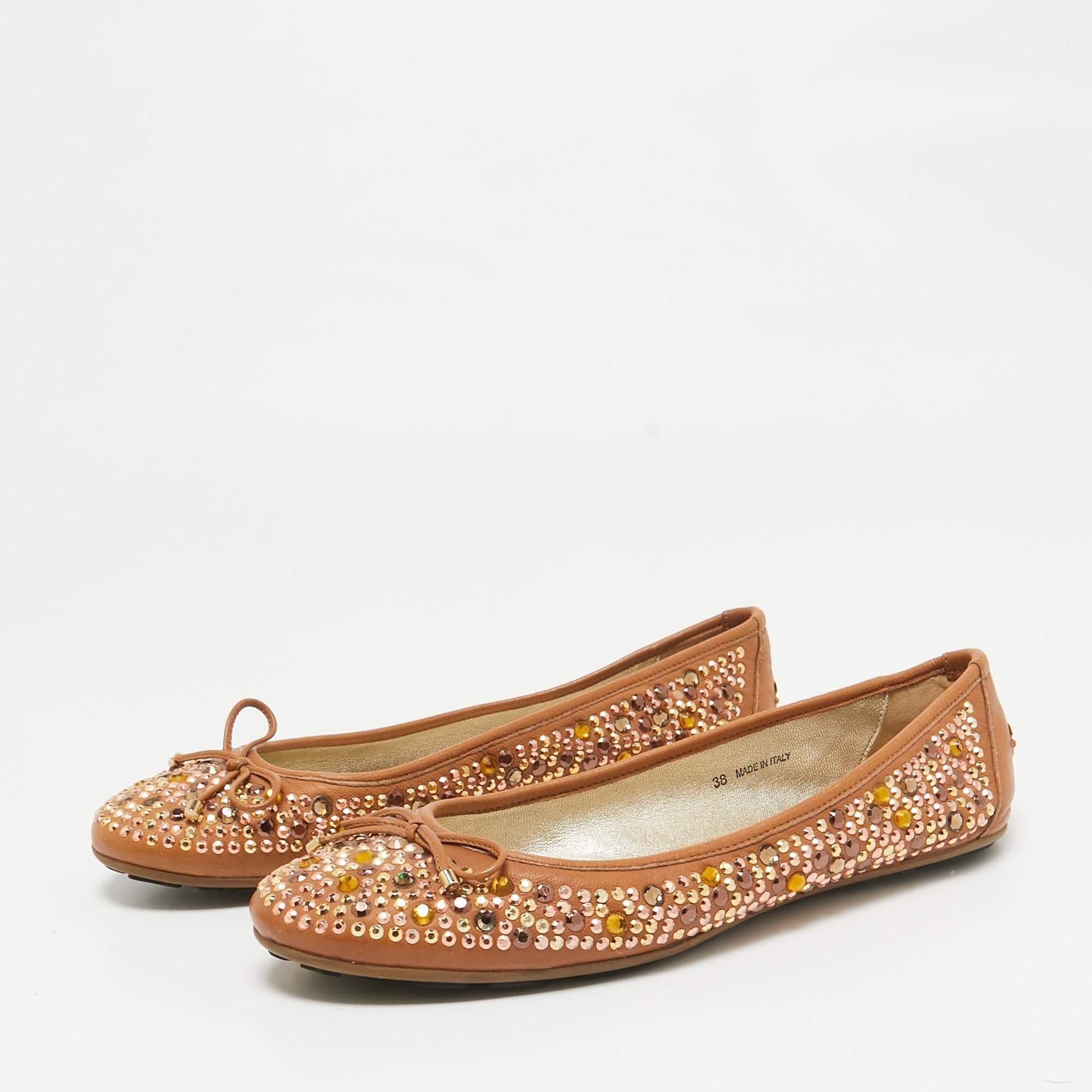 One would think that these ballet flats were created to be admired. Such beauty they carry They are from Jimmy Choo and theyve been crafted from crystal embellished leather and styled with delicate bows on the uppers. The brown flats are complete