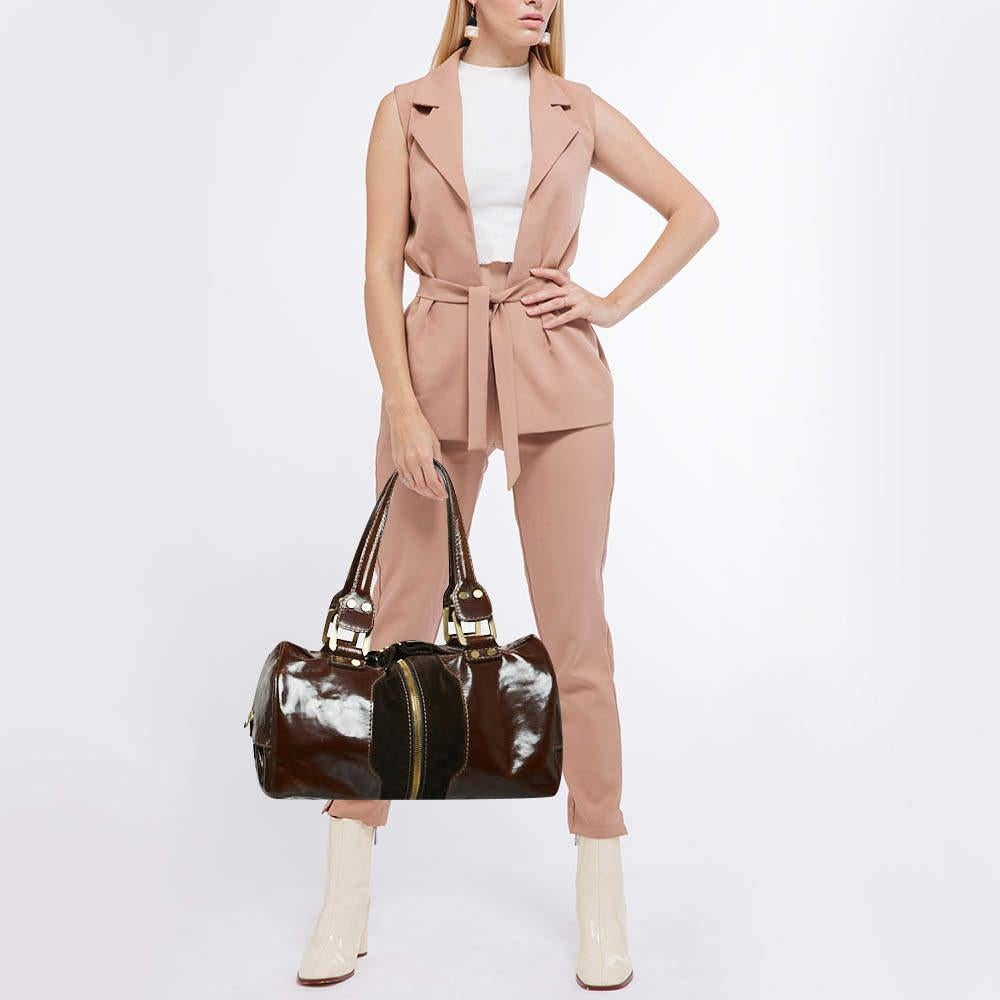 Designer bags are ideal companions for ample occasions Here we have a fashion meets functionality piece crafted with precision. It has been equipped with a well sized interior that can easily fit your small essentials.