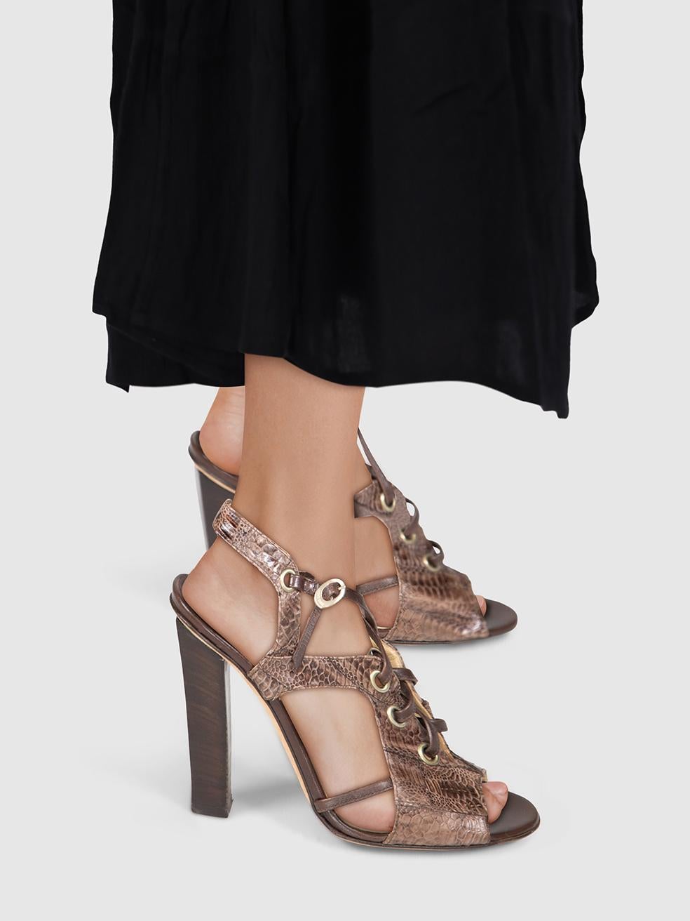 CONDITION is Very good. Minimal wear to heel is evident. Minimal wear to both insoles and both heel stems with abrasions seen on this used Jimmy Choo designer resale item.
 

 

 

 Details
 

 

 Brown
 

 Leather
 

 Heels
 

 Python embossed