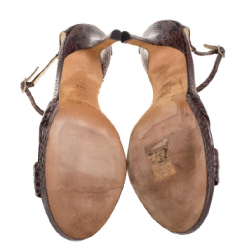 Mirroring the latest trends of the season that is minimal and stylish, this pair of Macy sandals from the house of Jimmy Choo has been designed to add a touch of vibrant grace to your look. Crafted from python leather in a brown shade, they feature