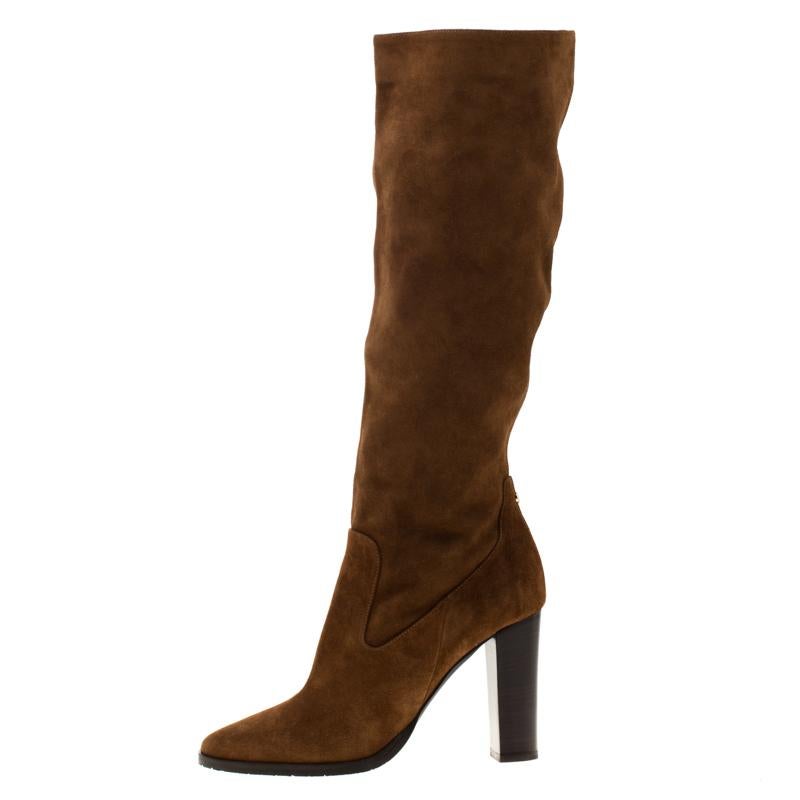 Simple and sophisticated, these knee length boots from Jimmy Choo are a must-buy for the fashionable you. These brown boots are crafted in suede and come balanced on 10 cm heels. They can be paired with a long tunic or an oversized shirt to make