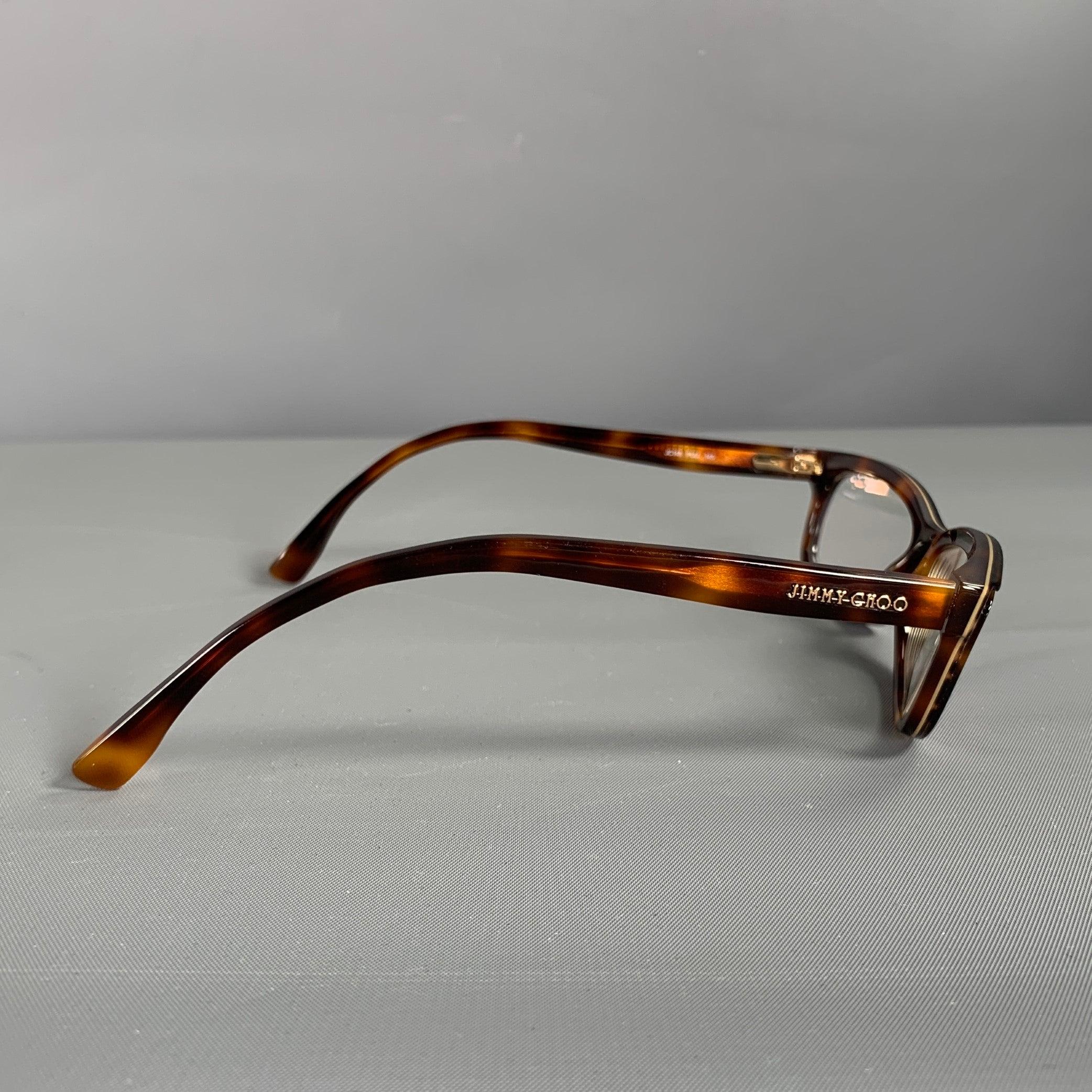 JIMMY CHOO readers frames comes in a brown tortoise acetate featuring Diopter +. Includes case. Made in Italy.Excellent Pre- Owned Condition. 

Marked:   JC148 PUU145 

Measurements: 
  Length: 14 inches Height: 3.5 cm.

  
  
 
Sui Generis