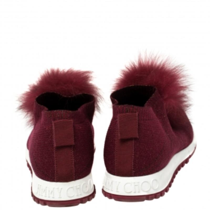 Here is Jimmy Choo's fun take on sneakers! Crafted in knit fabric, the low-top design has a slip-on style and statement pom-pom details on the uppers. Try them on with dresses as well as jeans.
