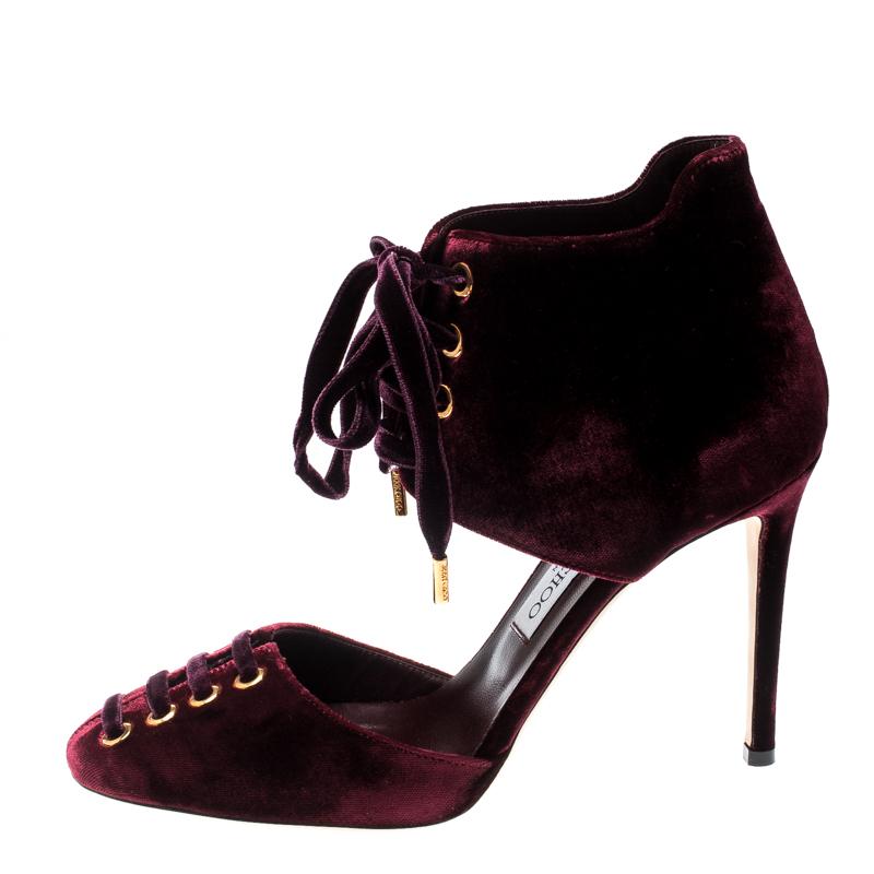 Look your stylish best for that special party wearing these stunning Jimmy Choo pumps. Designed in burgundy velvet, these pumps feature lace-ups on the vamps as well as the ankle cuffs. They are complete with round toes and high heels.

Includes: