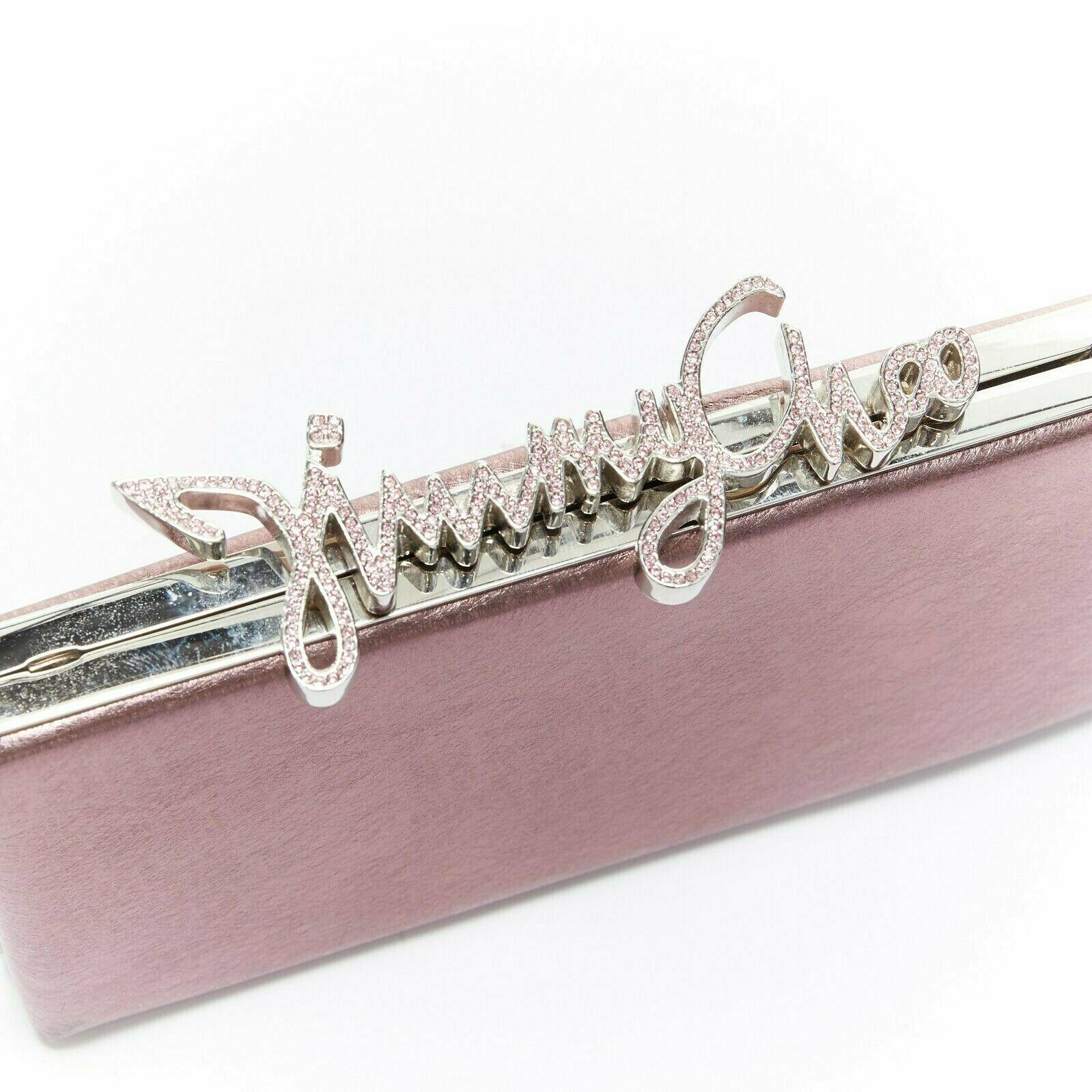 JIMMY CHOO Celeste pink metallic lame rhinestones logo silver chain frame clutch Reference: TGAS/A03354 
Brand: Jimmy Choo 
Designer: Jimmy Choo 
Model: Celeste 
Material: Leather 
Color: Pink 
Pattern: Other 
Closure: Snap 
Extra Detail: