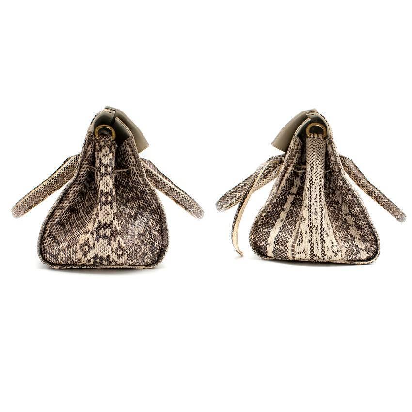 Jimmy Choo Cream and Grey python top handle/shoulder bag. 
Made in Italy. 

Top handle. 
Features an interior zipped pocket and an interior pouch. 
Includes an adjustable python shoulder strap. 

Accompanied by Jimmy Choo dust bag. 

Fabric: