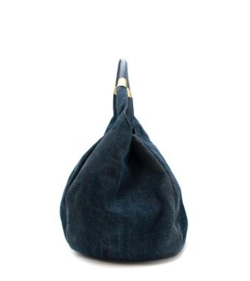 JXimmy Choo Denim Crystal Studded Hobo Bag

- Unstructured hobo style in mid-wash, midweight denim
- Central panel adorned with aged gold-tone metal studs and colourful glass crystals
- Functional central zip, allows you to conceal the embellished
