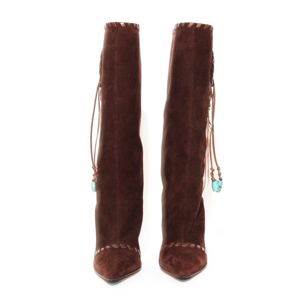 Suede and feather boot by Jimmy Choo 
Circa 2011
Chocolate suede
Knee-high boots
Pointed toes
Dream catcher adornments on side
Featuring feathers 
Tonal whipstitch trim
Slip-on
Made in Italy
Condition: Excellent, light scuffing and marks on sole.