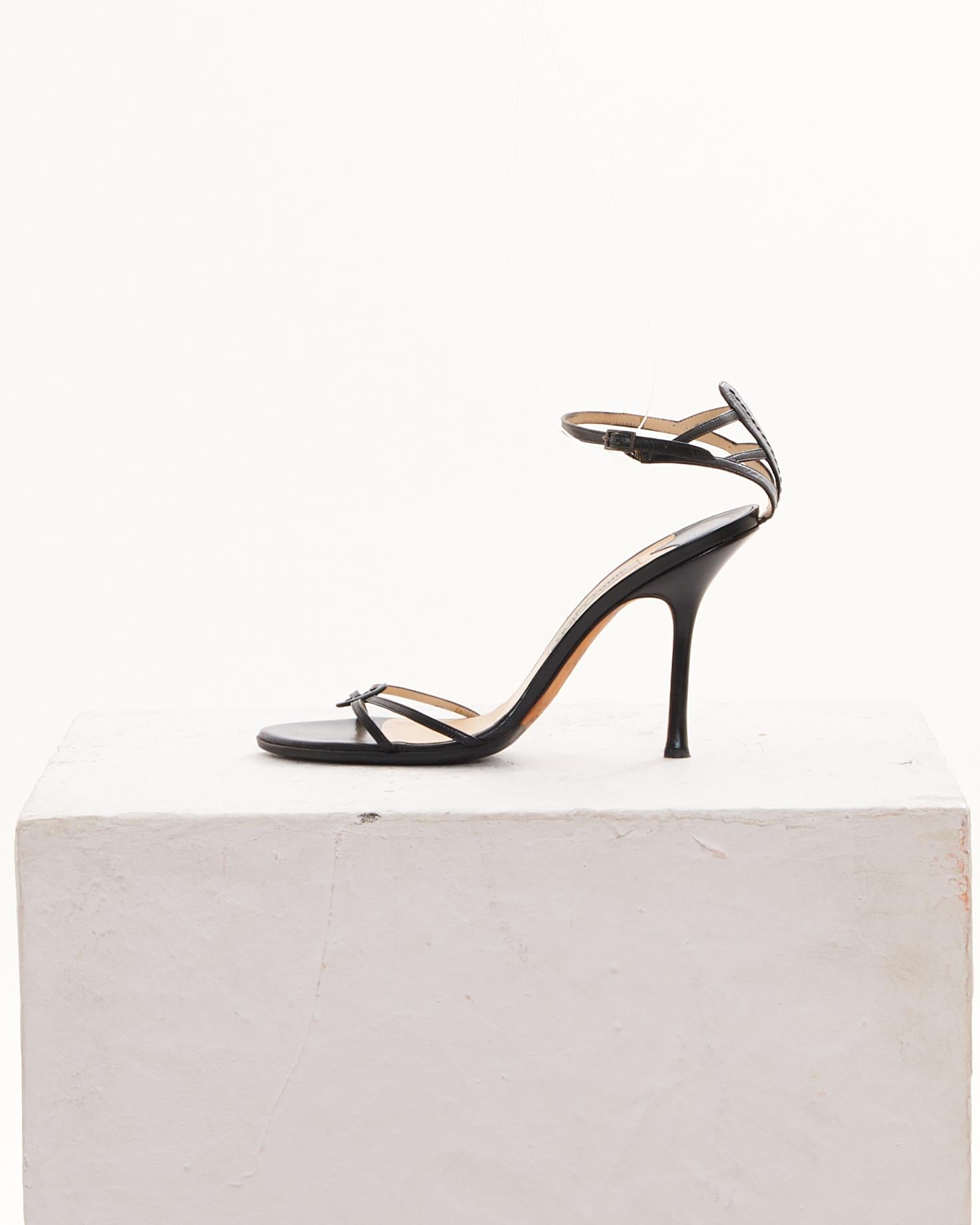 - Jimmy Choo early 2000s 
- Sold by Skof.Archive
- Black leather open toe sandals 
- Adjustable ankle strap with a buckle closure 
- Made in Italy 
- Good Conditions 
- Comes without original dust and box 
- Size: EN 40 1/2