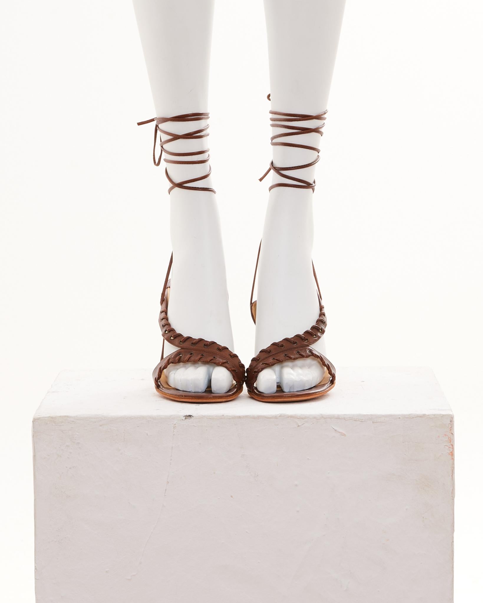 - Jimmy Choo Early 2000s 
- Sold by Skof.Archive
- Brown leather sandals 
- Open toes
- Corset-style vamps with ankle warps 
- 10cm heels 
- Bronze tone hardware 
- Finished with leather soles
- Made in Italy 
- Good conditions 
- Comes without