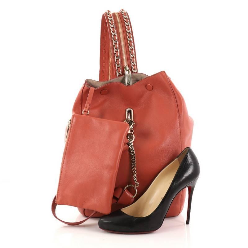 This authentic Jimmy Choo Echo Backpack Leather Medium showcases a versatile and ladylike design perfect for your daily looks. Crafted from salmon smooth leather, this backpack features elegant chain-embellished shoulder straps that can be zipped