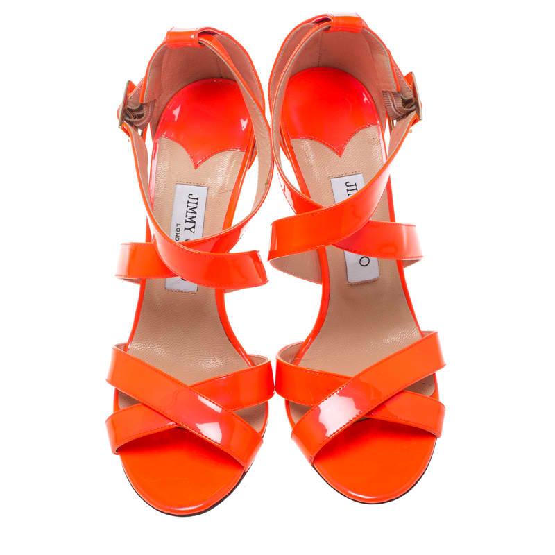 These Louise sandals from Jimmy Choo look absolutely breathtaking and will make you stand out in the crowd! The fluorescent orange sandals are crafted from patent leather and feature an open toe silhouette. They flaunt crisscross vamp straps and