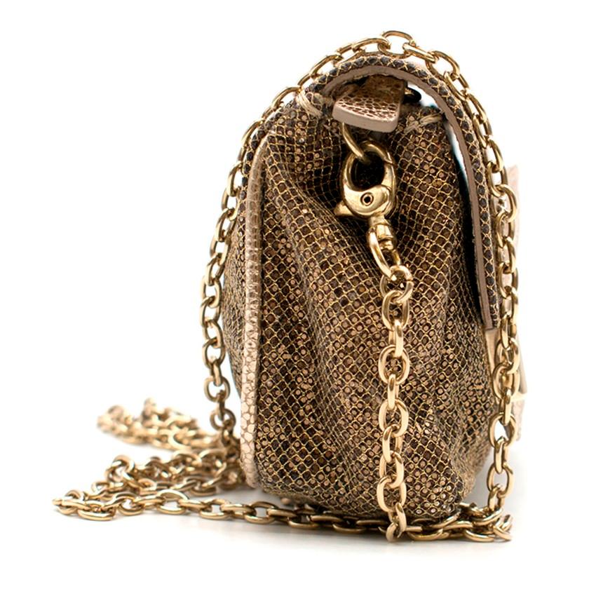 Jimmy Choo Glitter Crossbody Mini Bag.

- Slip through flap closure
- Concealed zip fastening
- Gold toned metal logo engraved front plaque
- Detachable crossbody chain 
- Small pouch in the interior
- Really small, please refer to the images & the