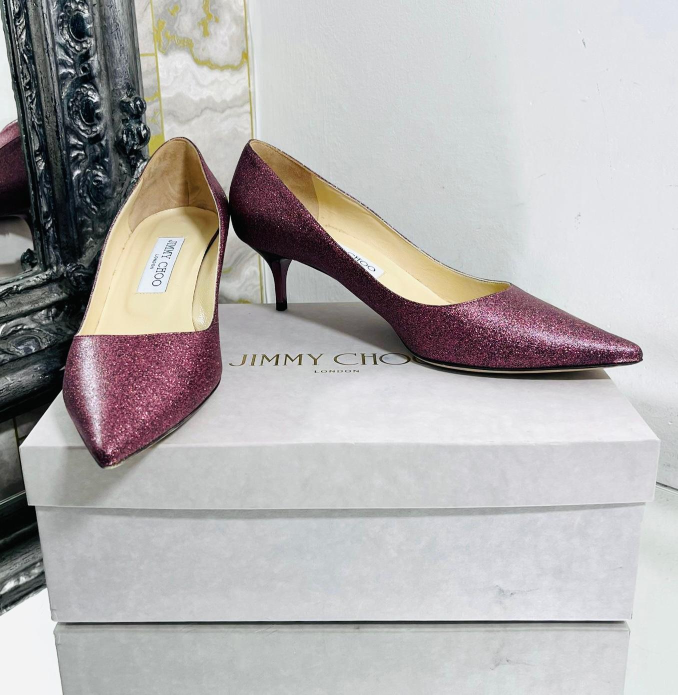 Jimmy Choo Glitter Pumps

Dark dusty fuchsia/purple glitter heels designed with tonal metallic short stiletto heel.

Featuring pointed toe, leather lining and insoles.

Size – 38.5

Condition – Very Good

Composition – Glitter, Leather

Comes with –