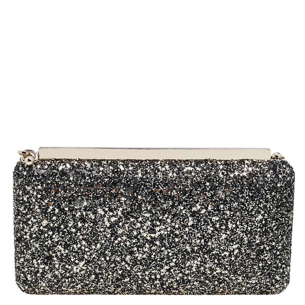Jimmy Choo's Ellipse clutch gets a stunning update with this gold and black version. Crafted from glitter in an elongated shape and equipped with a leather interior, it can be carried using the shoulder chain or as a clutch by tucking the chain