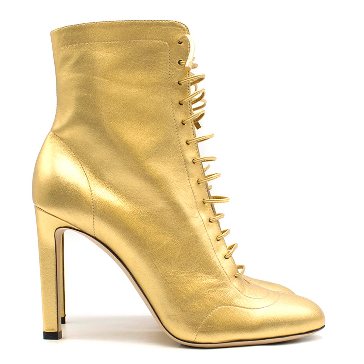 Jimmy Choo Gold Daize Metallic Leather Ankle Boots.

- Leather heeled ankle boots
- Lace-up fastening
- Side zip fastening
- Round toe
- Heel
- Laced front
- Leather upper
- Leather lining
- Leather and synthetic sole
- Made in Italy

Please note,