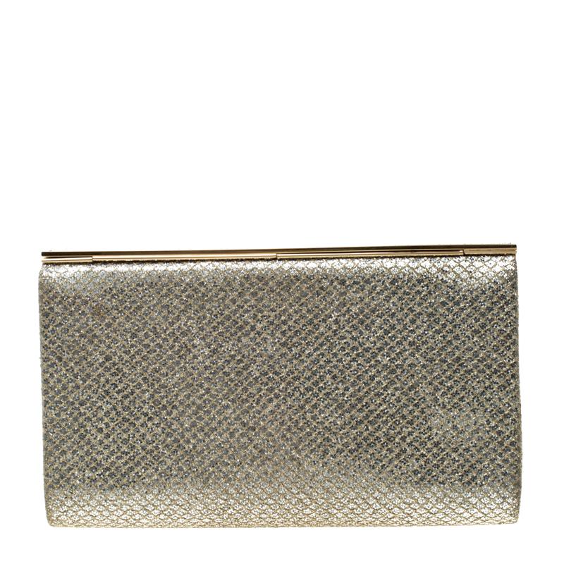 The rich, luxurious touch of Jimmy Choo is visible in this glitter clutch. It has a shimmery gold exterior along with a gold-tone metal frame on the top. The satin-lined interior comes with a slip pocket. Team this clutch with all your evening